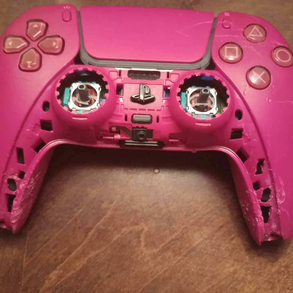 Gray and Pink Video Game Controllers